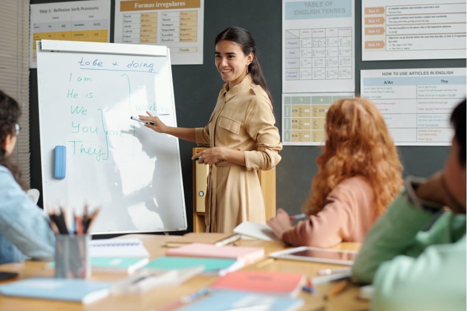 A teacher practicing with English language learners.